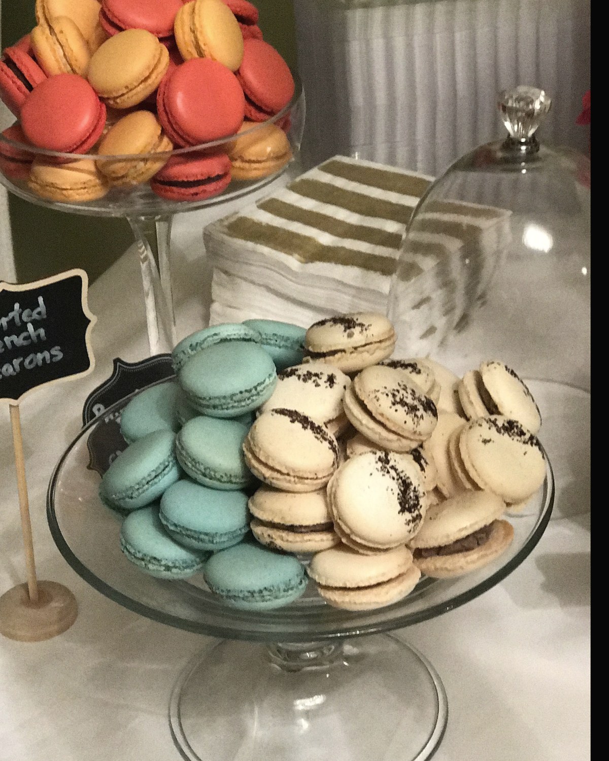 French macarons arranged on tiered glass stands