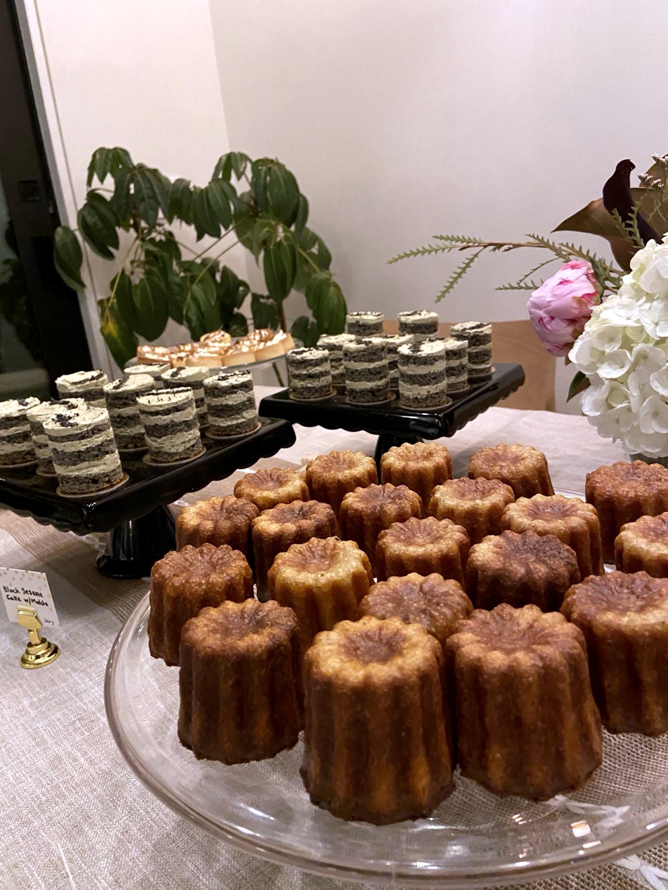Caneles arranged on a dessert table