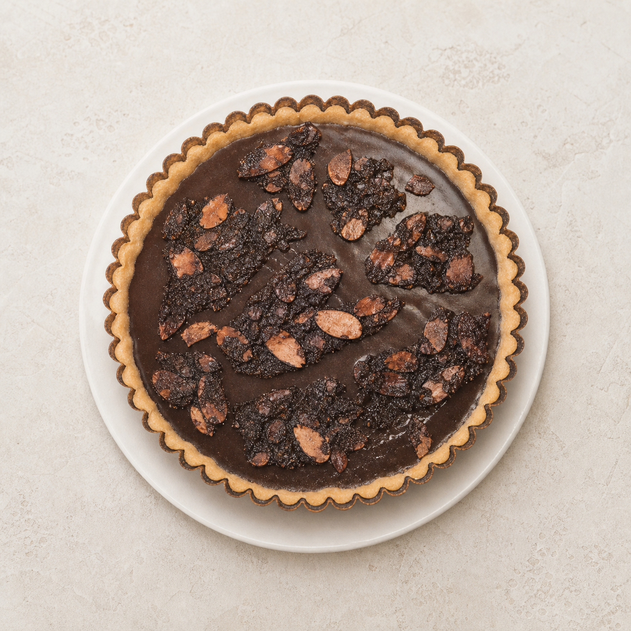 Chocolate tart with dried fruit and nuts